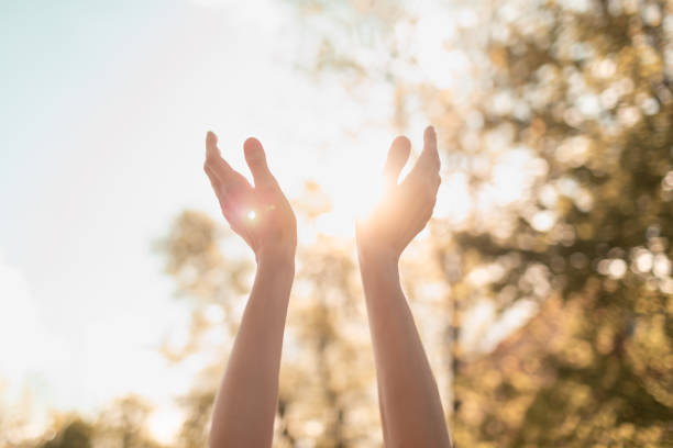 istock Hands raised up to the sunny sky. 1509518292