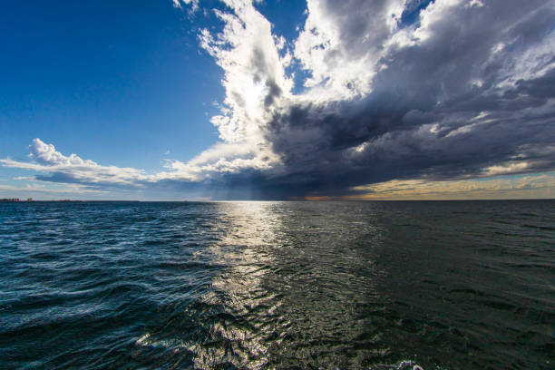 istock Dark rain clouds and storm forming over the ocean 1509518980