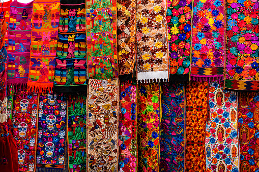 View of colorful indigenous maya fabric with different patterns on market in Chichicastenango, Guatemala