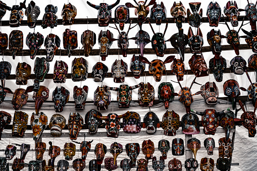 Mayan wooden, handcrafted masks on market for sale in Chichicastenango, Guatemala