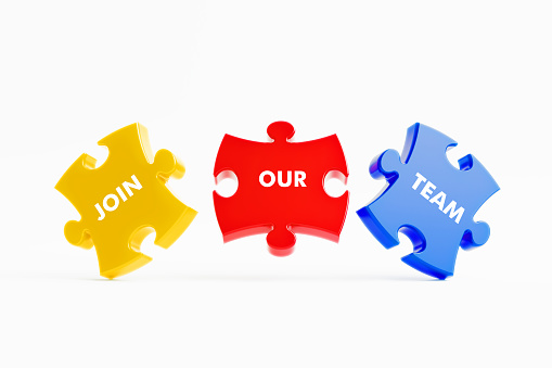 Join our team written jigsaw puzzle pieces on white background. Horizontal composition with copy space.