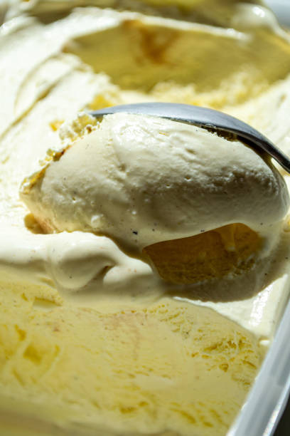 istock Vanilla ice cream scooped out of a container with a spoon 1509576430