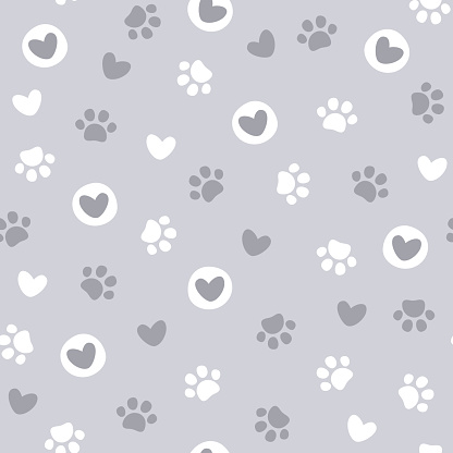 Pet paw seamless pattern. Vector illustration with paw and hearts on purple background. It can be used for wallpapers, wrapping, cards, patterns for clothes and other.