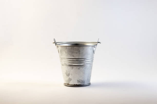 istock bucket of stainless material on a white background close-up 1509630354