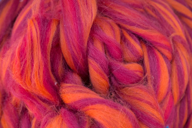 istock Multicolored strings of wool for felting and spinning as a background. 1509648557