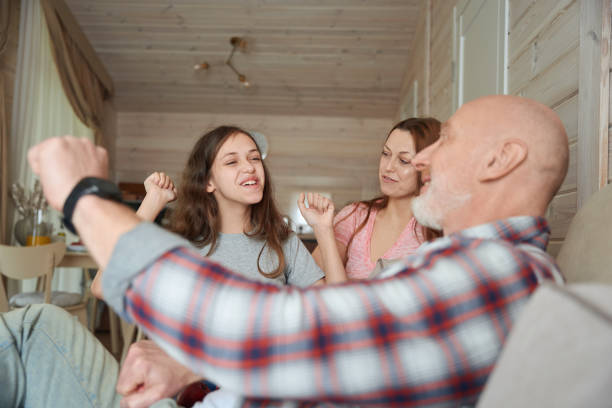 istock Cheerful daughter spending time with her parents at home 1509660712
