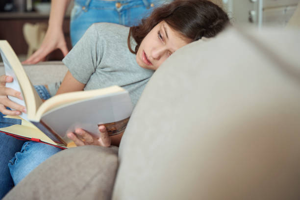 istock Serious young lady learning at home under parental supervision 1509660716