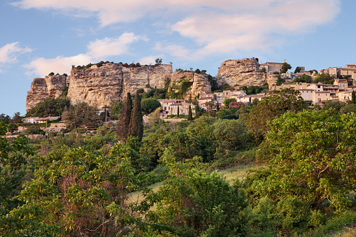 Saignon, Vaucluse, Provence-Alpes-Cote d'Azur, France: landscape of the ancient village with the the Rocher, the high rocks on the hill top