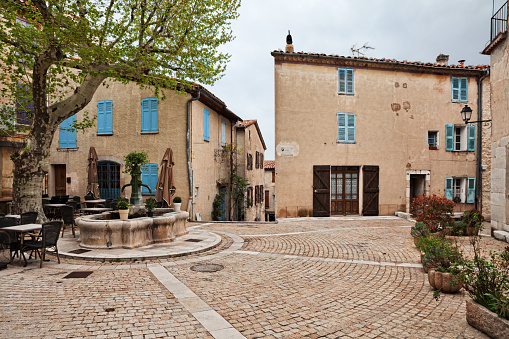 Mons, Var, Provence, France: small square with an old fountain in the picturesque ancient hill town