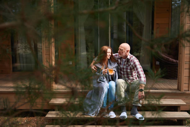istock Romantic man embracing his spouse on veranda during tea break 1509701442