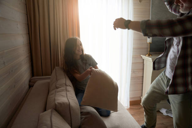 istock Joyous daughter spending time with her father at home 1509701446