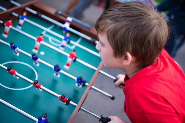 istock boy playing table football outside 1509718060