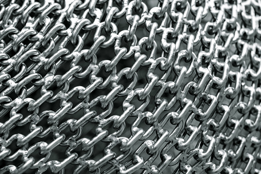 Closeup chain link, abstract background with copy space, full frame horizontal composition