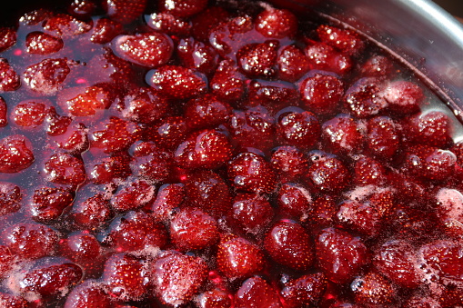 Homemade delicious strawberry jam resting in the sun