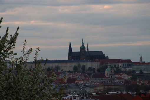 Sunset hours in Prague with clouds and church