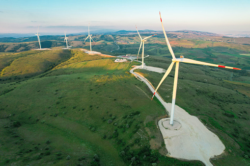 wind turbines at sunset, renewable energy source