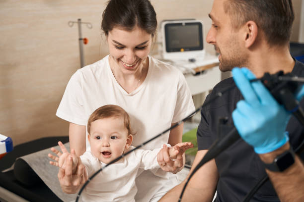 istock Endoscopist preparing child for endoscopy procedure under parental supervision 1509855288