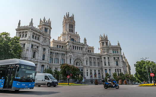 Madrid, Spain - June 28, 2023: View of the Cibeles Palace (Palacio de Cibeles), formally known as Palace of Communications until 2011, is a complex made up of two buildings with white facades and is located in one of the historic centers from Madrid, Spain. Now is occupied by Madrid City Council, serving as the city hall, and the public cultural centre CentroCentro.