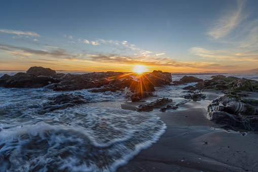 A sunburst at sunset over Carpinteria State Beach, California.  Photo by Bob Gwaltney.