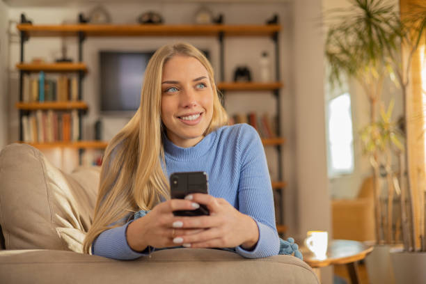 istock Happy young woman using phone 1509985778