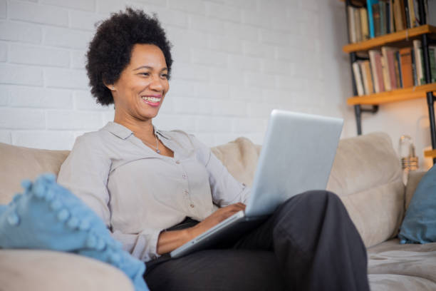 istock Mid adult woman working from home 1509987540