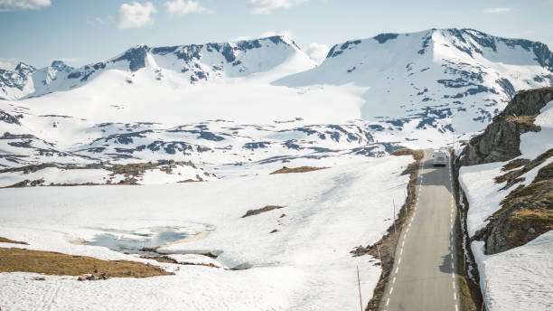 istock Scenic Norwegian Wilderness Road Covered by Snow and a Camper Van 1509995047