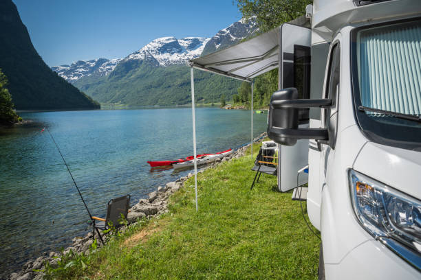 istock Camper Van and the Norwegian Waterfront Camping with Kayaks 1509997561