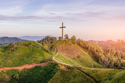 Easter concept. Beautiful landscape with road leads up to cross. Religion concept.Christianity background