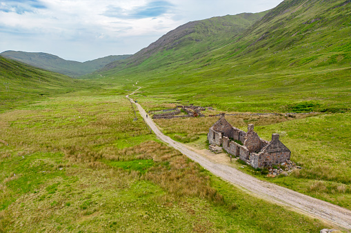 Aerial view of West Highland Way, valley with farmhouse ruins near Fort William, Scotland.