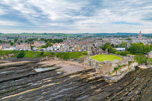Drone view of St. Andrews, Fife Scotland with St. Andrews Castle ruins.