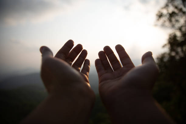 istock Human hands open palm up worship. Eucharist Therapy Bless God Helping Repent Catholic Easter Lent Mind Pray. Christian Religion concept background. fighting and victory for god 1510017185