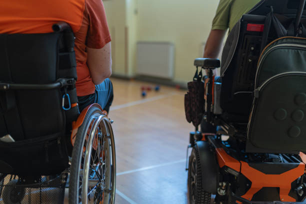 istock Two disabled friends trained dystrophy boccia together. 1510018354