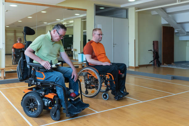 istock Two disabled friends trained dystrophy boccia together. 1510018356