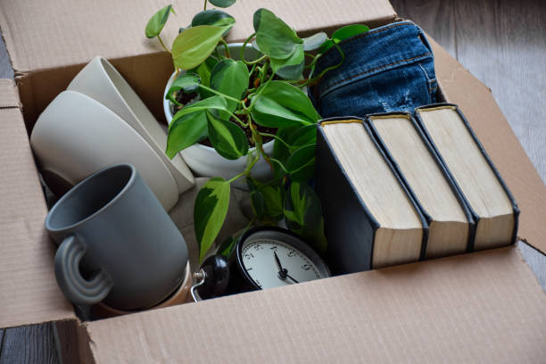 istock Cardboard box packed with personal belongings for moving 1510085855