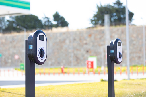 Electric Car Charging Station In Outdoor Parking