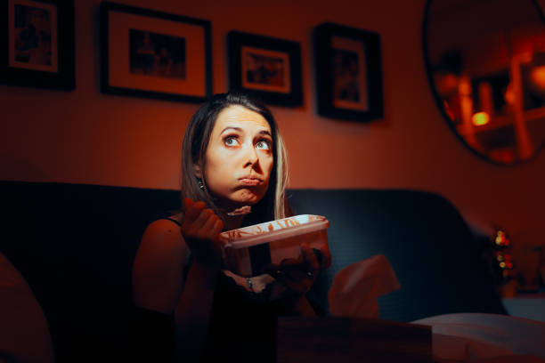 istock Stressed Woman Eating Ice-Cream at Night 1510124790