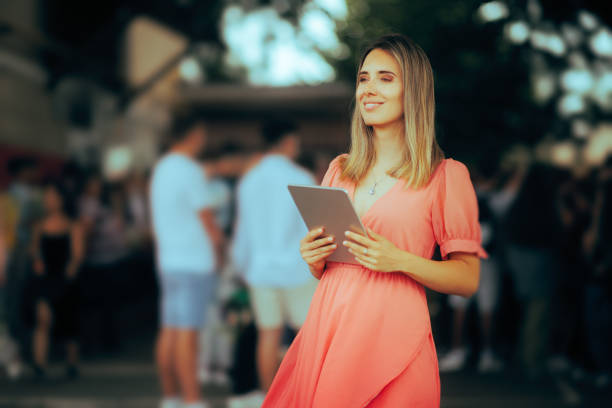 istock Beautiful Weeding Planner Holding a Tablet Pc Outside 1510143665
