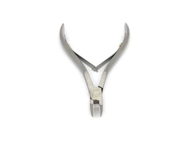 istock Close up of manicure and cuticle scissors isolated on white background. 1510148287