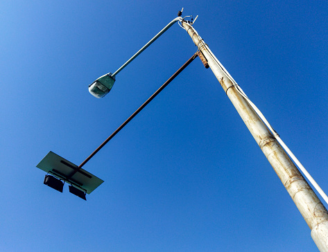 street light that use solar energy shoot from below  with great blue sky and white cloud, Landscape orientation
