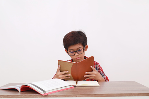 Reading Seriously Asian Student Reading Book Seriously Isolated On White Background Stock ...