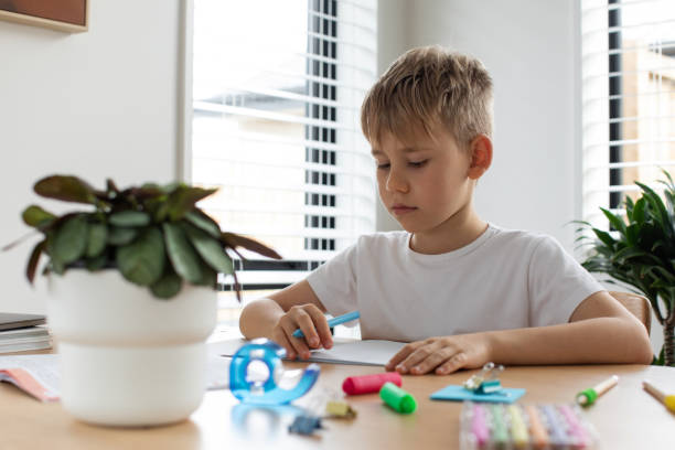 istock Cute boy doing school assignments at home. The concept of home education. Elementary school. 1510322013