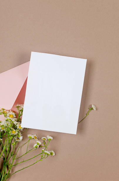 istock Pink envelope with empty white card for text on beige background 1510441418