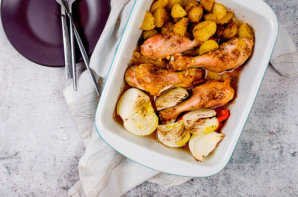 istock Roasted chicken legs and potatoes served in a baking dish 1510441962