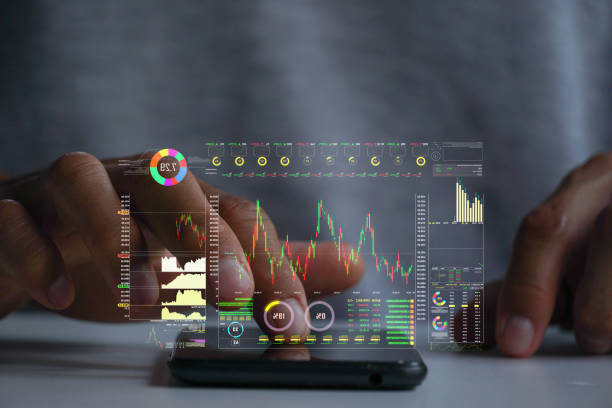 istock A men using smart phone for analyze a stock market exchange. Business data number futuristic hologram background. 1510452727