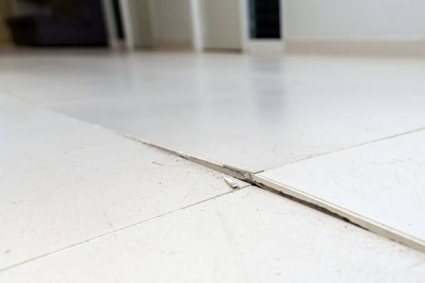 istock Floor cracked and broken from concrete inflate in house or office building. 1510460297