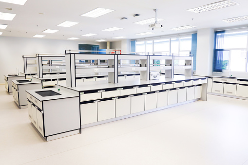 Laboratories with furniture in science classroom interior of university college. Laboratory casework in medical and clinical laboratory room.