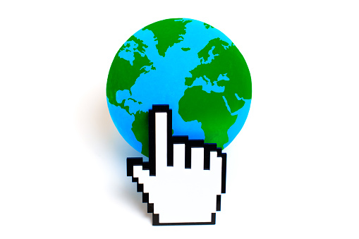 White pixelated hand cursor clicks on a vibrant green and blue globe, symbolizing global connectivity and digital interaction.