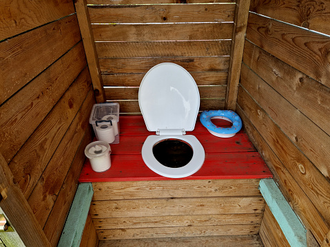 toiletries at the children's camp. board for defecation. the digester is full of flies and stinks in the summer. a shanty town cannot do without an improvised latrine. there is no sewage system, lavatory, latrine,wc