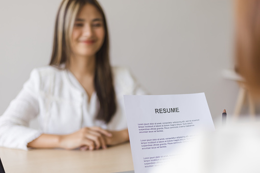 Close-up resume paper while job interview.