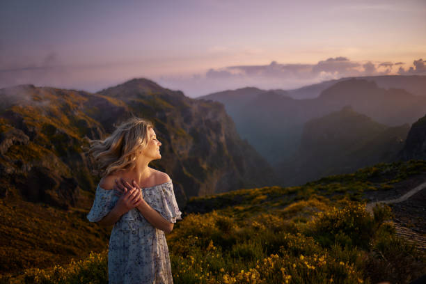 istock Happy woman enjoying in spring day on a mountain. 1510564496